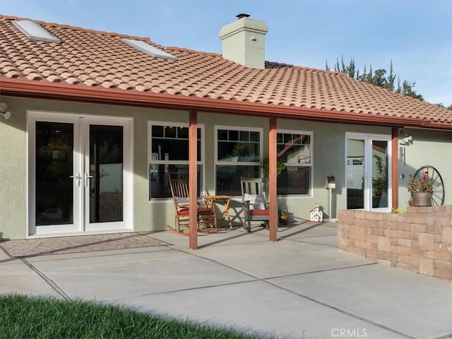 back of house featuring french doors and a patio