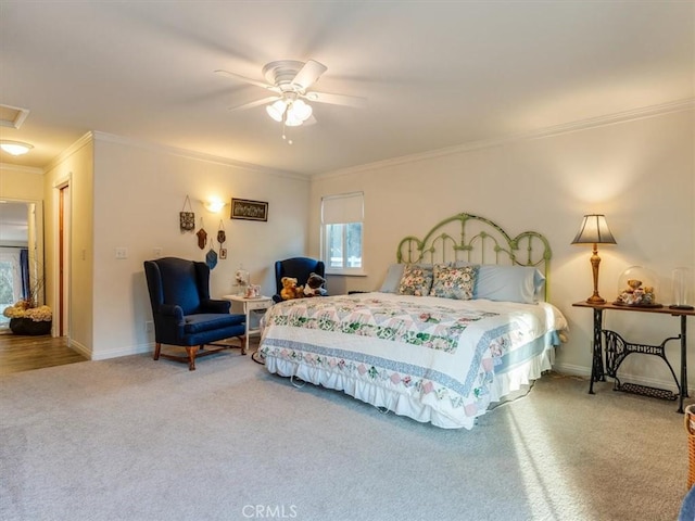 bedroom featuring carpet flooring, ceiling fan, and ornamental molding