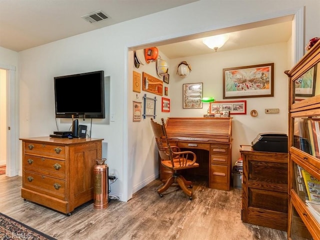 office space with hardwood / wood-style floors