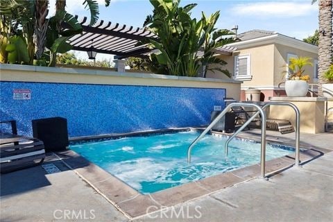 view of swimming pool with a pergola