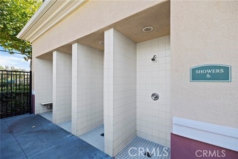 bathroom with tile patterned floors and tiled shower