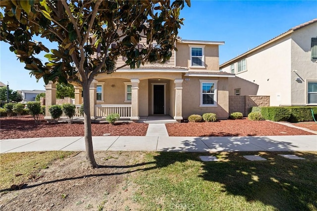 view of front of home with a front lawn and covered porch