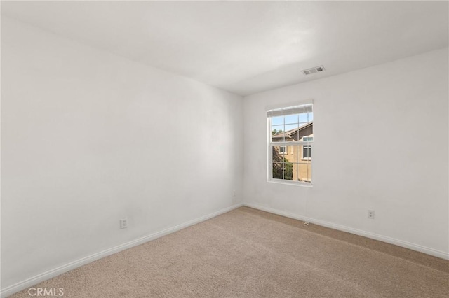 spare room featuring carpet flooring