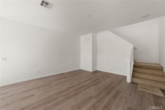 unfurnished living room with hardwood / wood-style floors