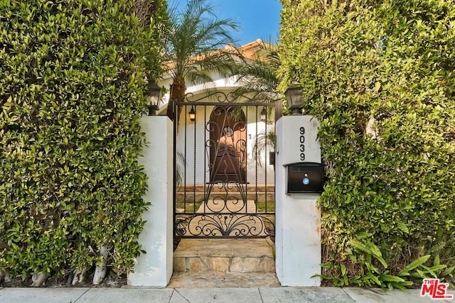 view of gate with water heater