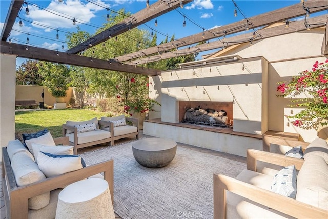 view of patio / terrace with exterior fireplace