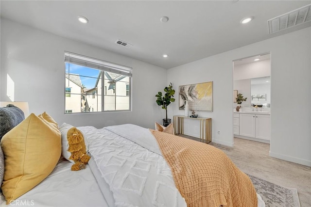 carpeted bedroom with connected bathroom