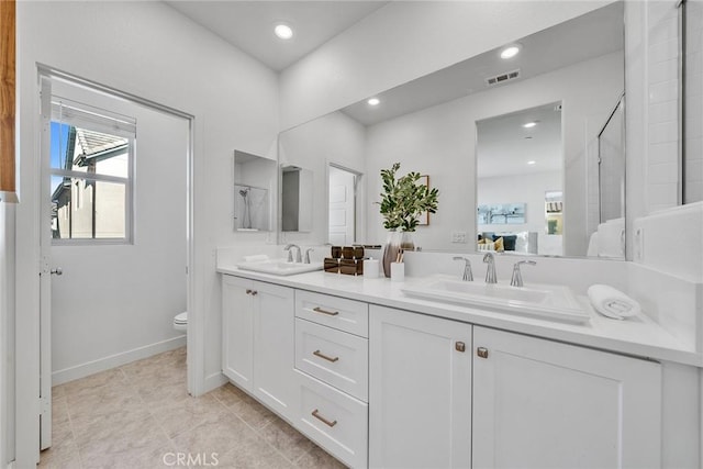 bathroom with tile patterned floors, vanity, and toilet