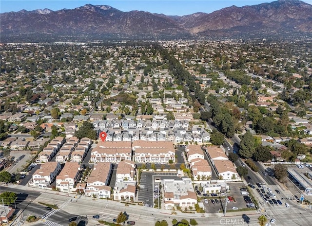 birds eye view of property featuring a mountain view