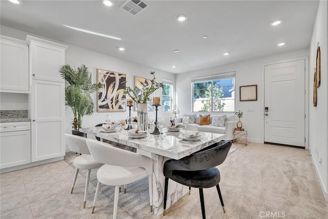 view of carpeted dining space