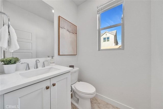 bathroom featuring tile patterned flooring, vanity, and toilet