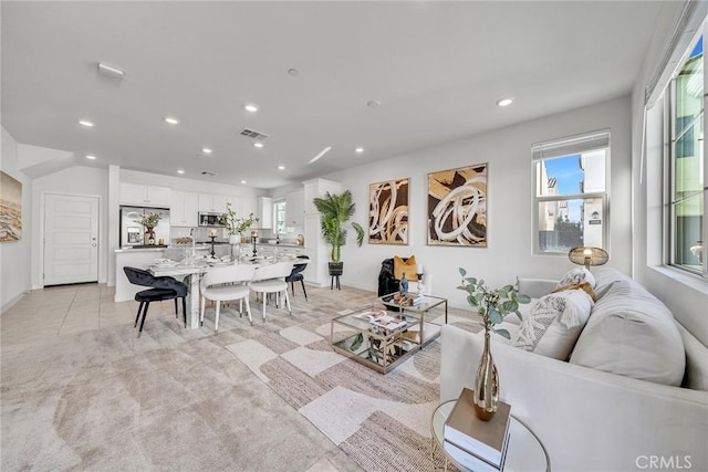 living room with light colored carpet