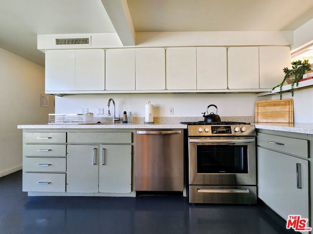 kitchen featuring sink, white cabinetry, and stainless steel appliances