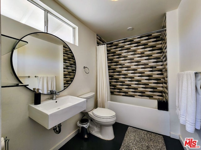 full bathroom with toilet, sink, and shower / tub combo with curtain