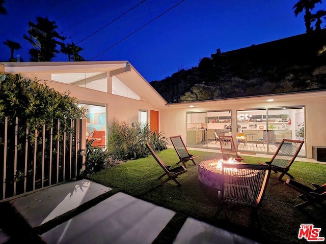 exterior space with a fire pit