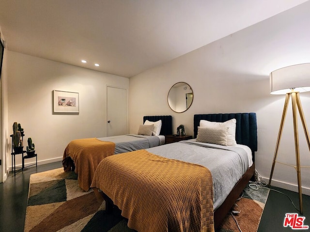 bedroom featuring dark hardwood / wood-style flooring