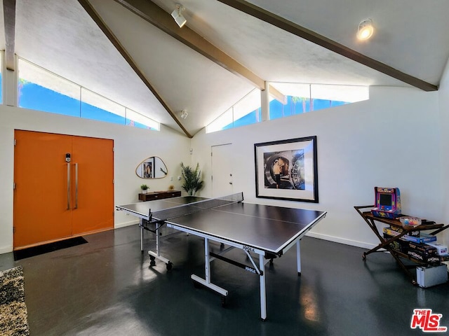 playroom featuring plenty of natural light, beam ceiling, and high vaulted ceiling