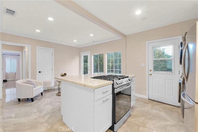 kitchen with visible vents, crown molding, recessed lighting, stainless steel appliances, and white cabinetry