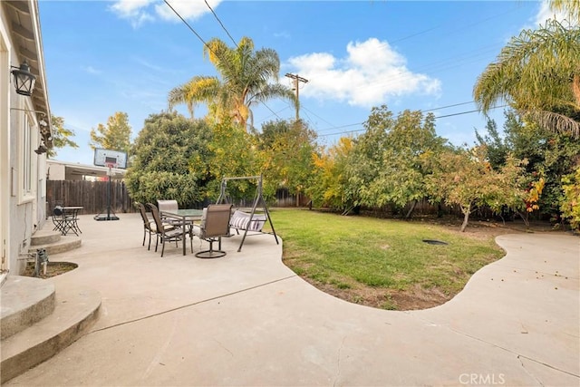 view of patio / terrace with outdoor dining space and a fenced backyard