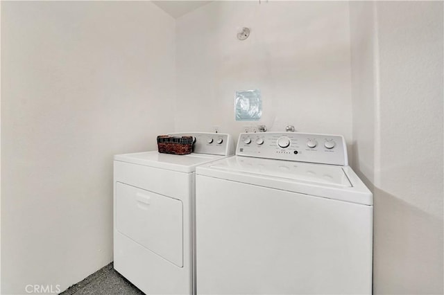 clothes washing area with washer and dryer