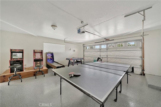 game room with a textured ceiling