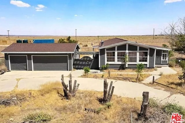 ranch-style house featuring a garage