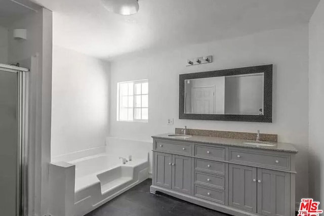 bathroom featuring plus walk in shower and vanity