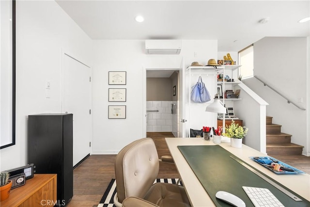 interior space featuring dark hardwood / wood-style flooring and a wall mounted AC