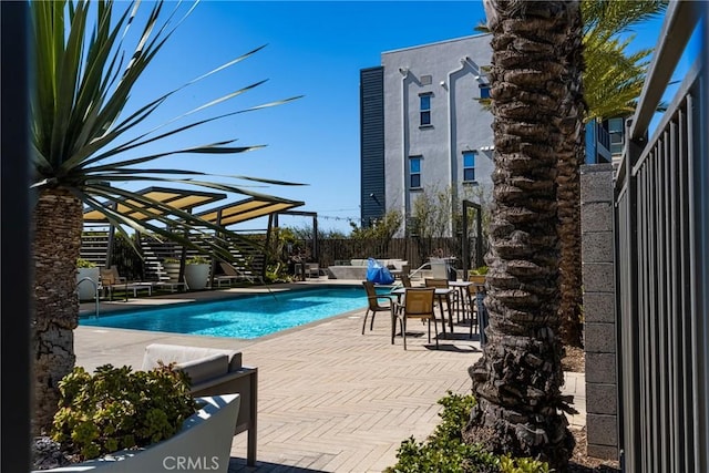 view of swimming pool featuring a patio