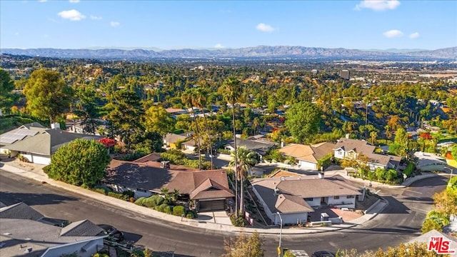 drone / aerial view featuring a mountain view