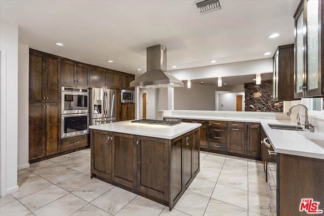 kitchen featuring dark brown cabinetry, a center island, sink, stainless steel appliances, and island range hood