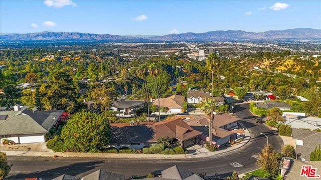 birds eye view of property featuring a mountain view