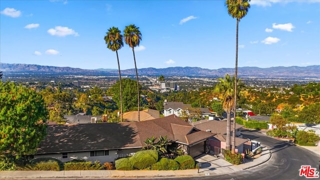 birds eye view of property with a mountain view