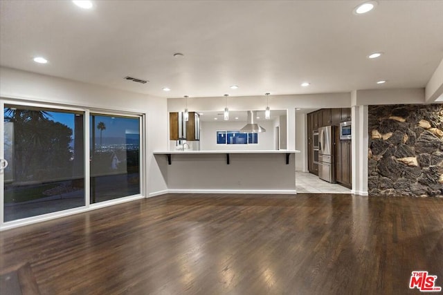 unfurnished living room with light wood-type flooring