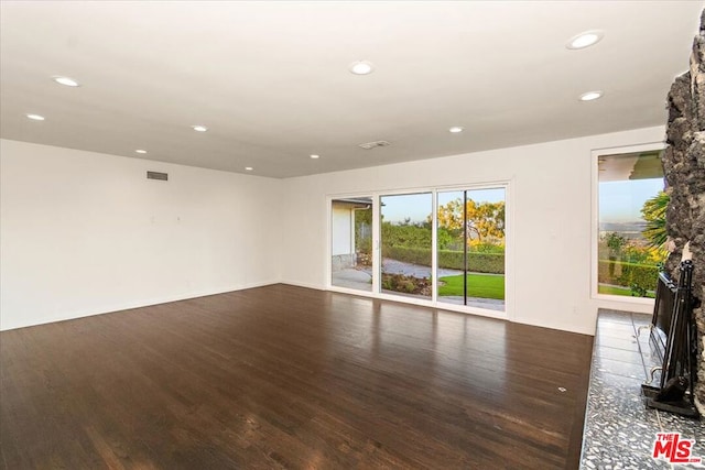 empty room with dark hardwood / wood-style floors