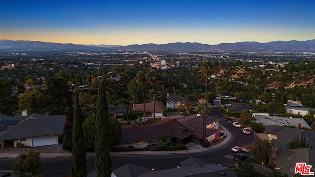 aerial view at dusk with a mountain view