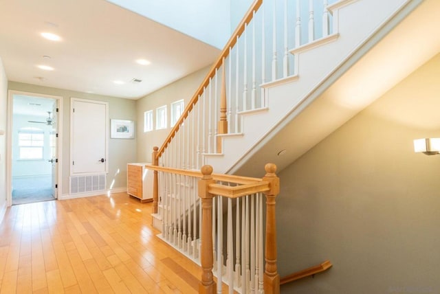 staircase featuring wood-type flooring