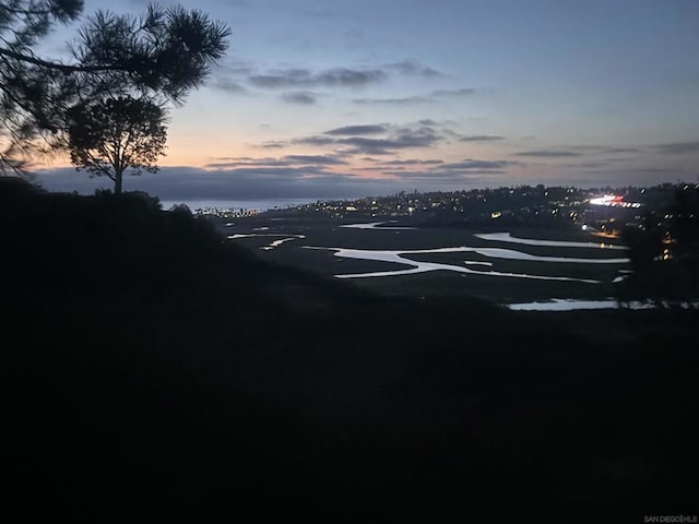 view of parking at dusk