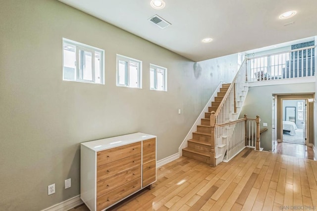 stairs with hardwood / wood-style floors