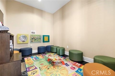 game room featuring lofted ceiling