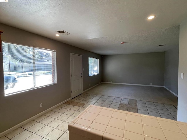 interior space featuring a textured ceiling