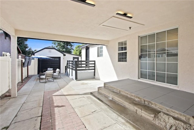 view of patio / terrace featuring an outbuilding