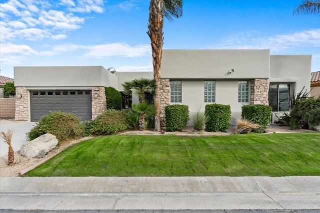 view of front of house featuring a garage and a front yard