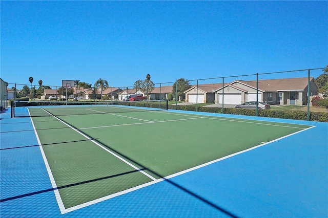 view of sport court featuring basketball hoop