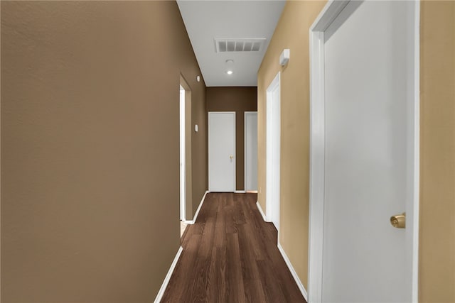 corridor featuring dark hardwood / wood-style floors