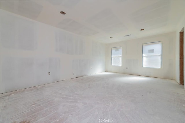 empty room featuring light carpet