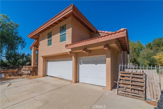 view of side of property with a garage