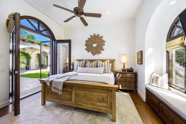 bedroom featuring wood-type flooring, access to exterior, and ceiling fan