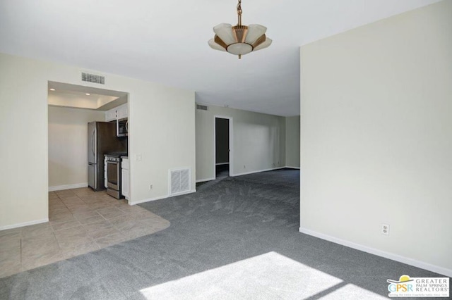 unfurnished living room with light carpet