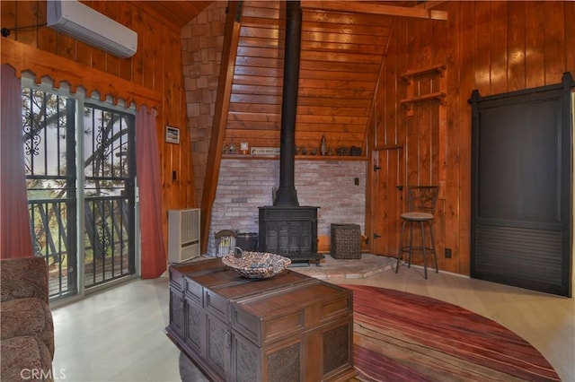 living room with a wall unit AC, a wood stove, and wooden walls